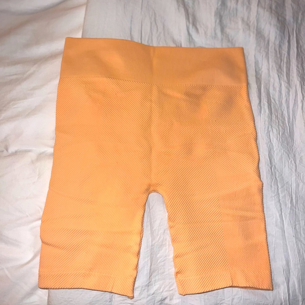 Lightweight Orange (light orange) soft and stretchy biker shorts. Lightly worn